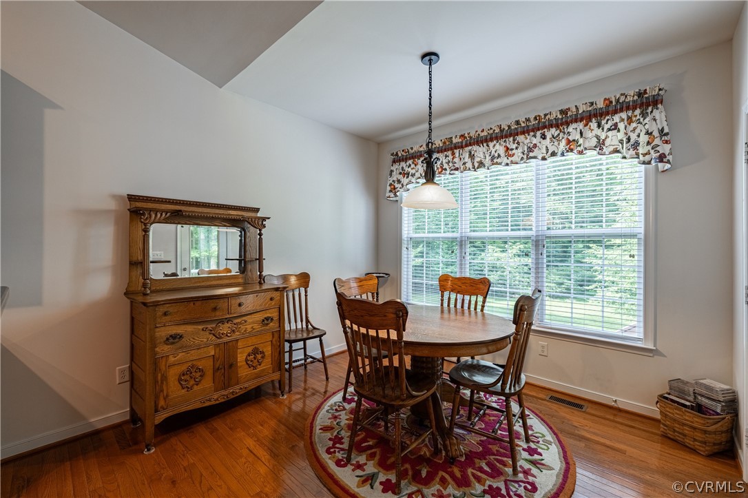 125 Jesse's Way Farmville, VA 23901 - Photo 16 of 42 a view of a dining room with furniture window and wooden floor