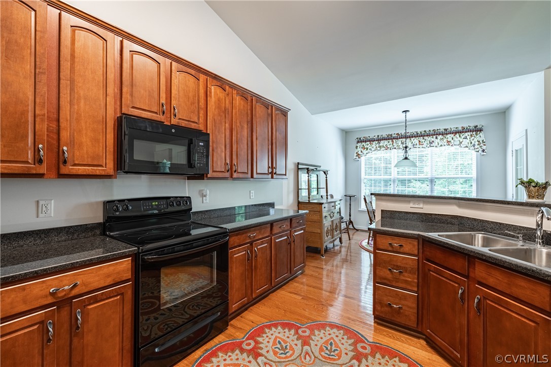 125 Jesse's Way Farmville, VA 23901 - Photo 8 of 42 a kitchen with stainless steel appliances granite countertop wooden cabinets and a stove top oven