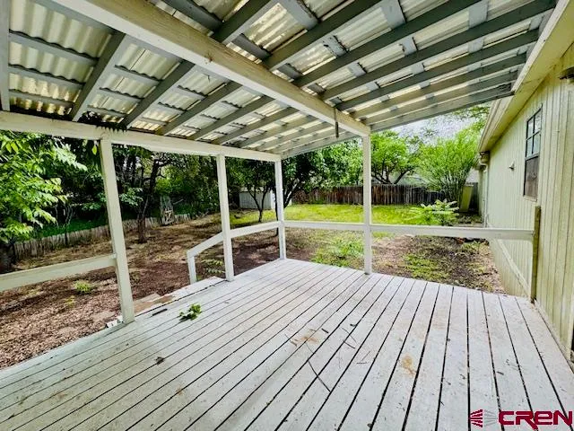 a view of a backyard with wooden floor