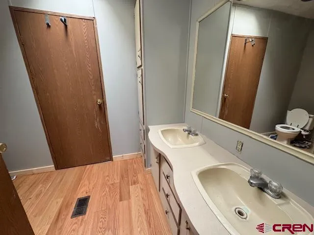 a bathroom with a sink and mirror