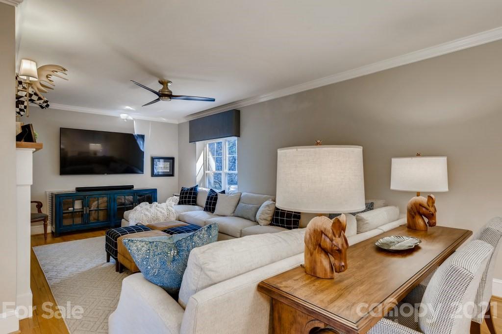 19032 Mountainview Drive Cornelius, NC 28031 - Photo 12 of 44 a living room with furniture and a flat screen tv