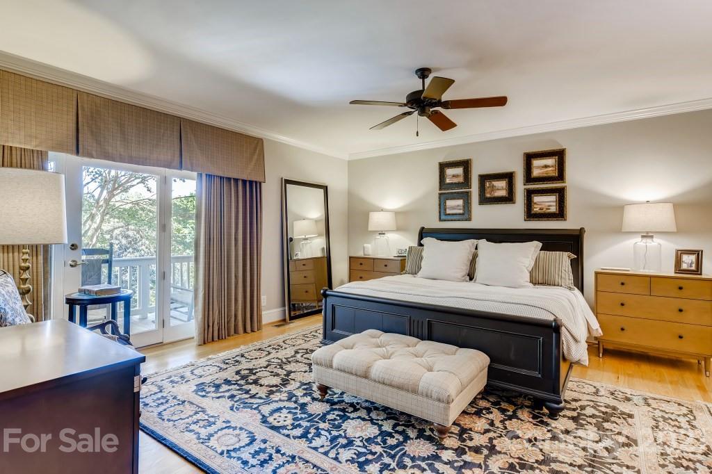 19032 Mountainview Drive Cornelius, NC 28031 - Photo 16 of 44 a bedroom with a bed and wooden floor