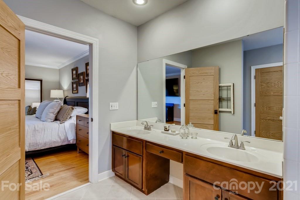 19032 Mountainview Drive Cornelius, NC 28031 - Photo 18 of 44 a en suite bathroom with a double vanity sink and a mirror