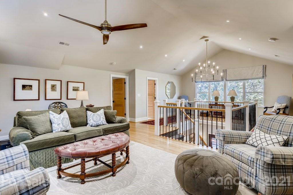 19032 Mountainview Drive Cornelius, NC 28031 - Photo 26 of 44 a living room with furniture a ceiling fan and a rug