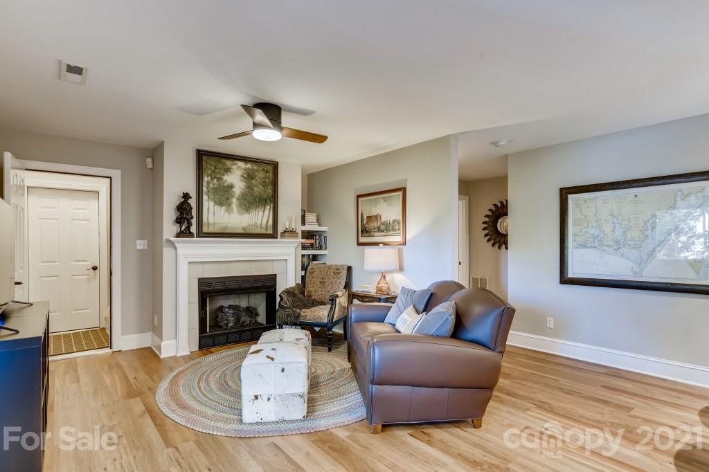19032 Mountainview Drive Cornelius, NC 28031 - Photo 27 of 44 a living room with furniture and a fireplace