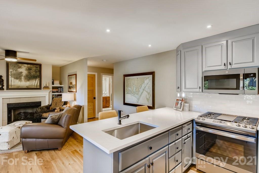 19032 Mountainview Drive Cornelius, NC 28031 - Photo 30 of 44 a kitchen with stainless steel appliances granite countertop a sink and a stove