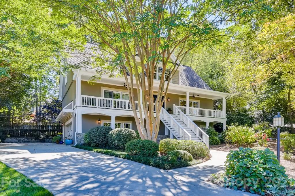 19032 Mountainview Drive Cornelius, NC 28031 - Photo 3 of 44 a front view of a house with a garden