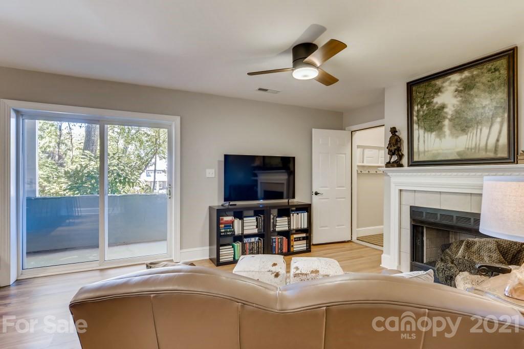 19032 Mountainview Drive Cornelius, NC 28031 - Photo 31 of 44 a living room with furniture and a fireplace