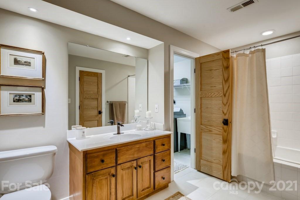 19032 Mountainview Drive Cornelius, NC 28031 - Photo 33 of 44 a bathroom with double vanity sink and a mirror