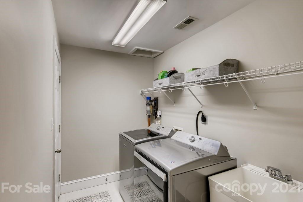 19032 Mountainview Drive Cornelius, NC 28031 - Photo 34 of 44 a bathroom with a sink and mirror