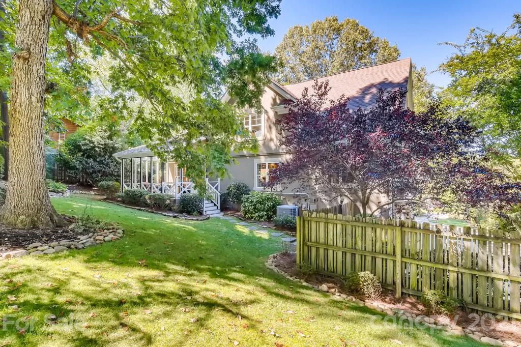 19032 Mountainview Drive Cornelius, NC 28031 - Photo 37 of 44 a view of a garden with a house in the background