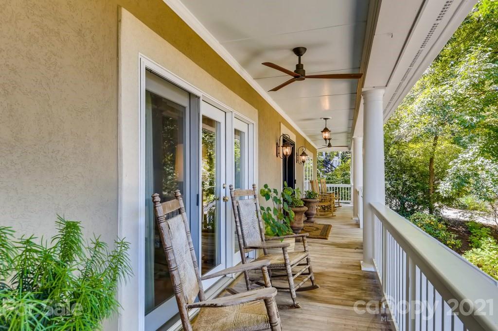 19032 Mountainview Drive Cornelius, NC 28031 - Photo 4 of 44 a view of a porch with chairs and potted plants