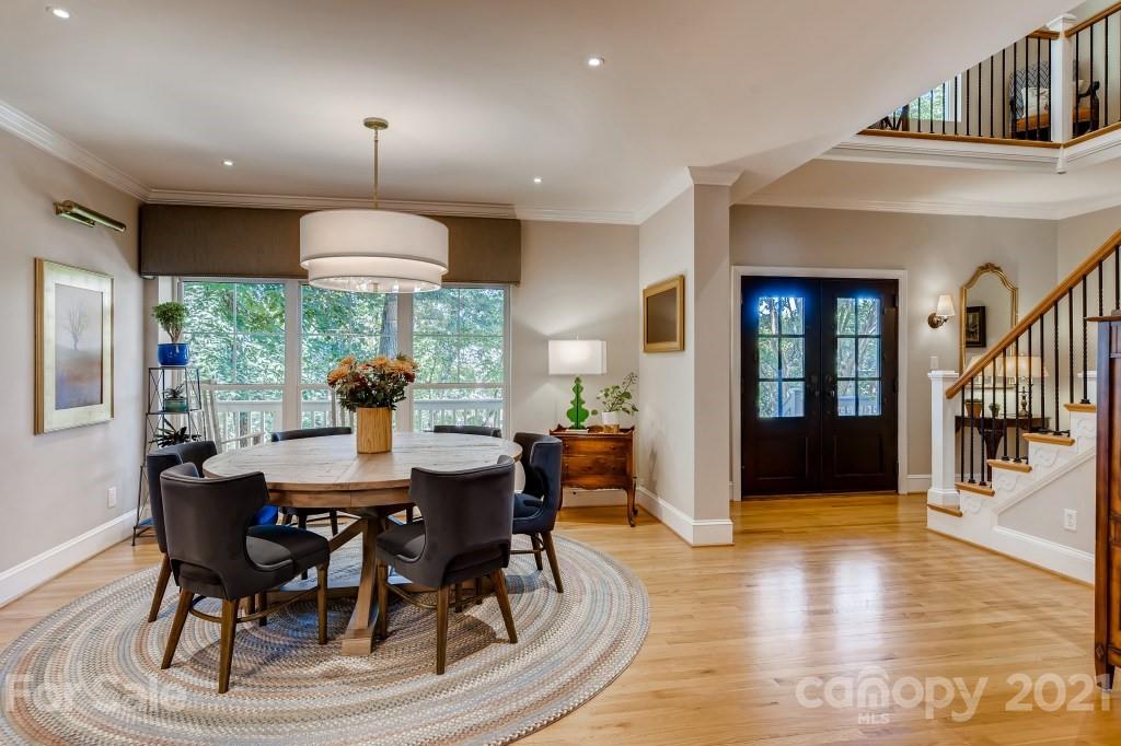 19032 Mountainview Drive Cornelius, NC 28031 - Photo 6 of 44 a view of a dining room with furniture window and wooden floor