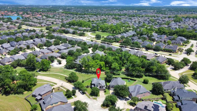 an aerial view of house with yard