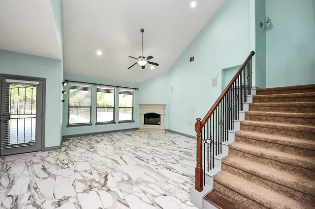 an empty room with closet and a bathroom