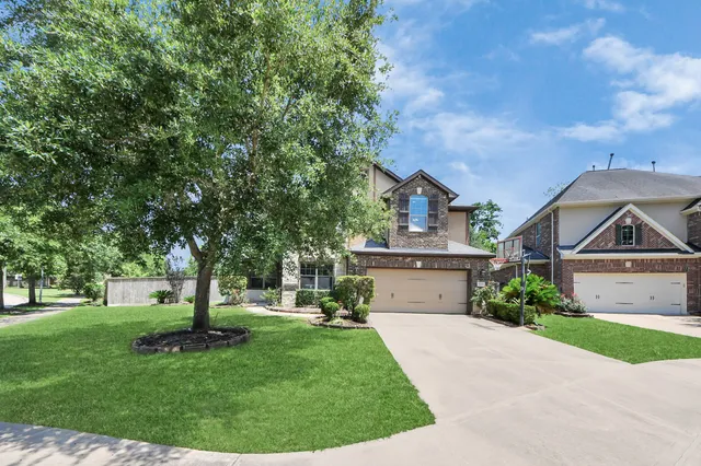 a front view of house with yard and outdoor seating