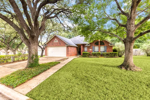 a front view of a house with yard