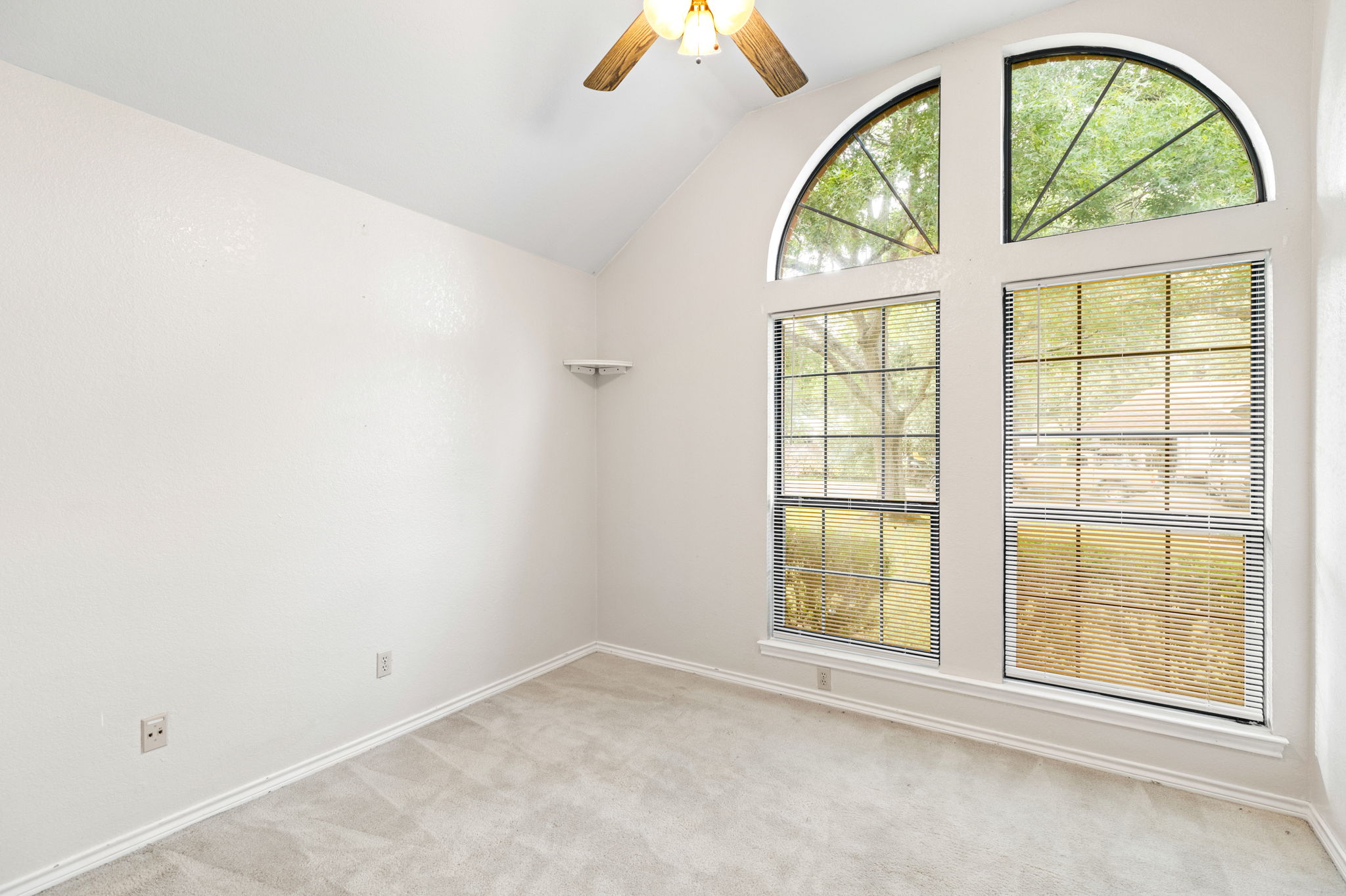 1502 Oak Knoll Lane Lockhart, TX 78644 - Photo 14 of 18 Bedroom featuring light colored carpet, ceiling fan, and lofted ceiling