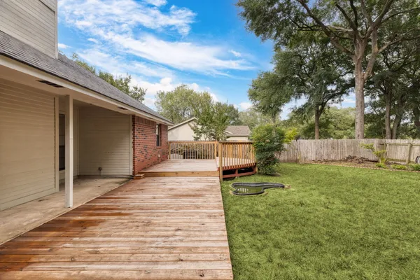 a view of a backyard with sitting area