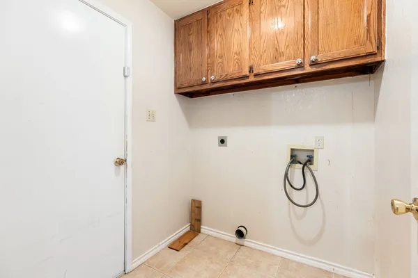 a bathroom with a granite countertop sink and a window