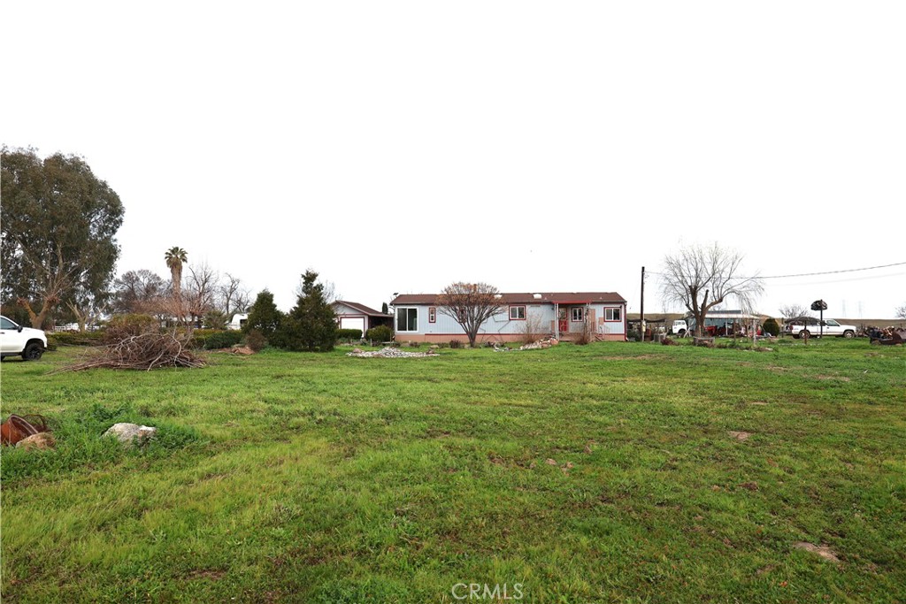 20490 Corning Road Corning, CA 96021 - Photo 11 of 51 a view of a grassy field with houses