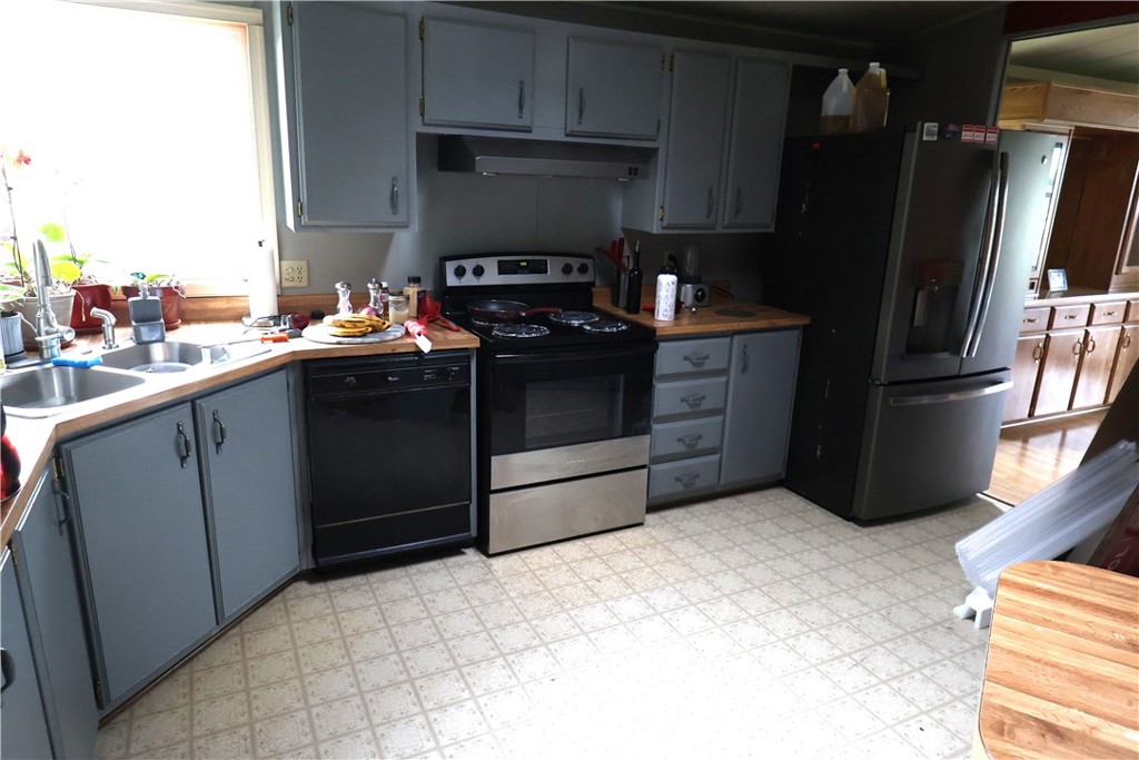 20490 Corning Road Corning, CA 96021 - Photo 24 of 51 a kitchen with a refrigerator stove and sink