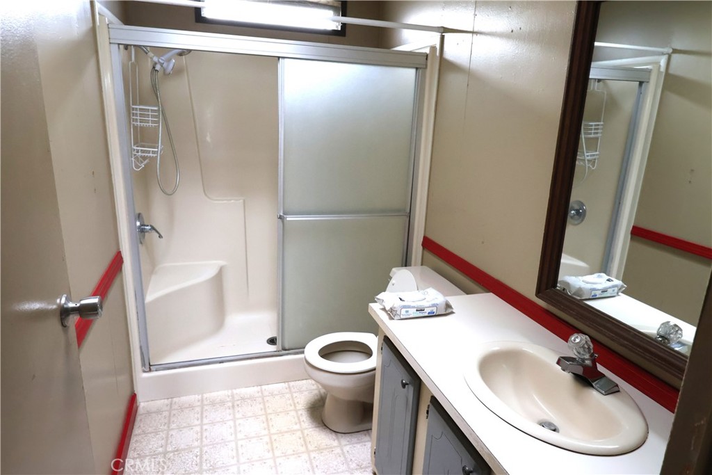 20490 Corning Road Corning, CA 96021 - Photo 29 of 51 a bathroom with a sink toilet and shower