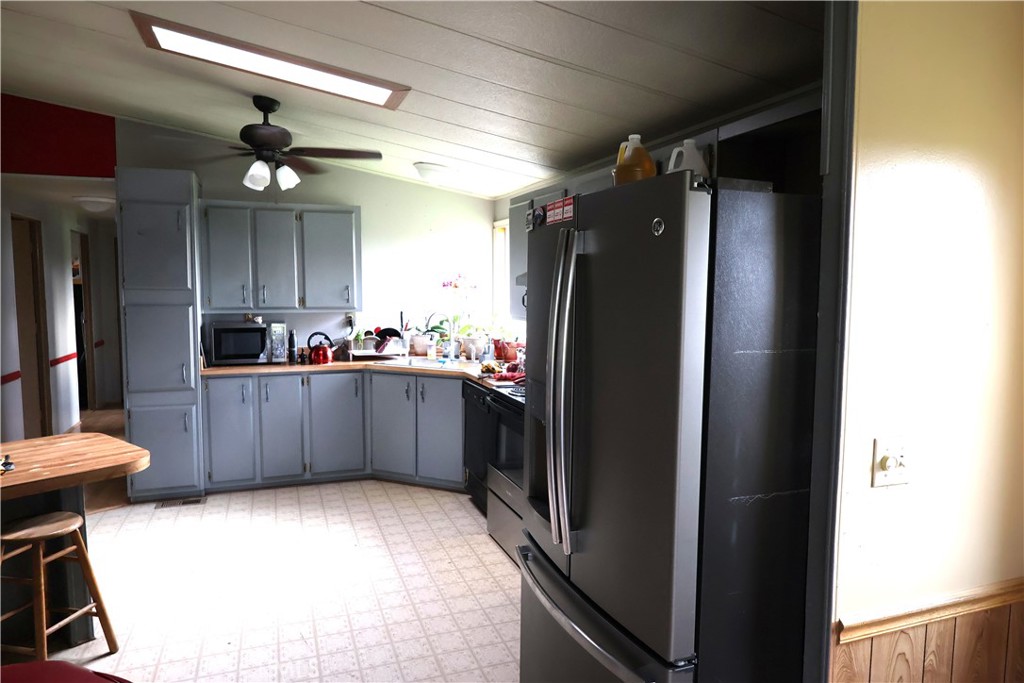 20490 Corning Road Corning, CA 96021 - Photo 40 of 51 a kitchen with stainless steel appliances a refrigerator and a cabinets