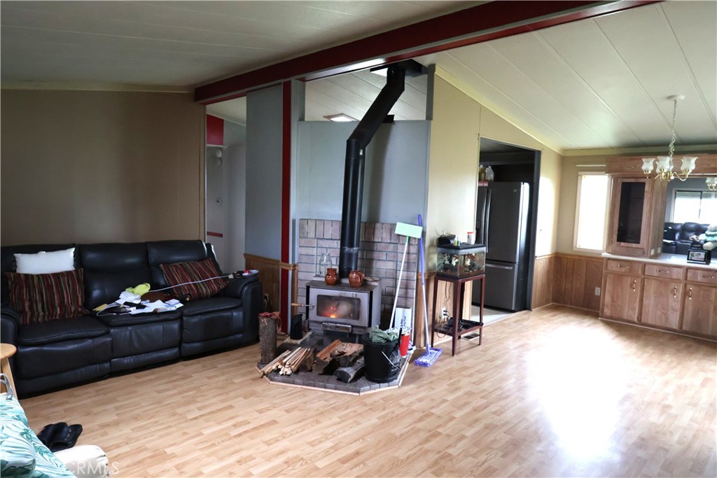 20490 Corning Road Corning, CA 96021 - Photo 43 of 51 a living room with furniture hard wood floor and a fireplace