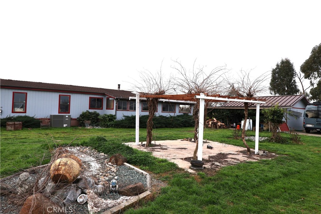 20490 Corning Road Corning, CA 96021 - Photo 5 of 51 a view of a house with backyard and a tree