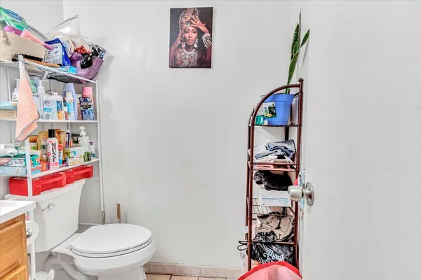 a bathroom with a toilet and a shower curtain