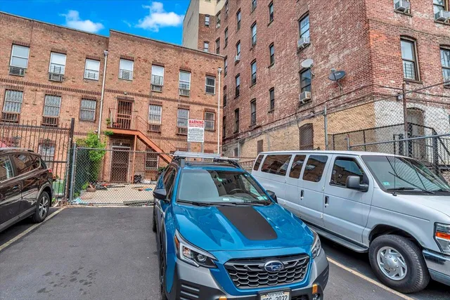 a view of a car park in front of a building
