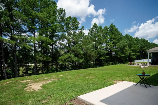 a view of a backyard with sitting area