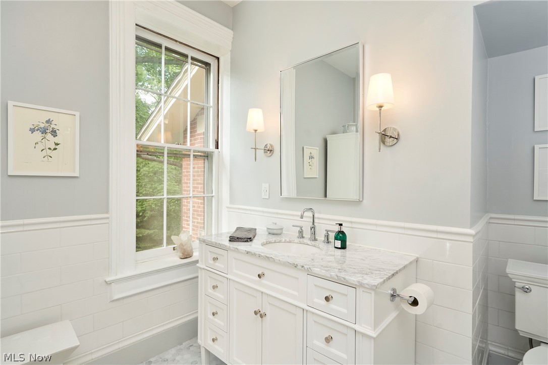 5046 Alger Road Richfield, OH 44286 - Photo 34 of 49 Vanity with a light-colored countertop, undermount sink, and polished chrome faucet