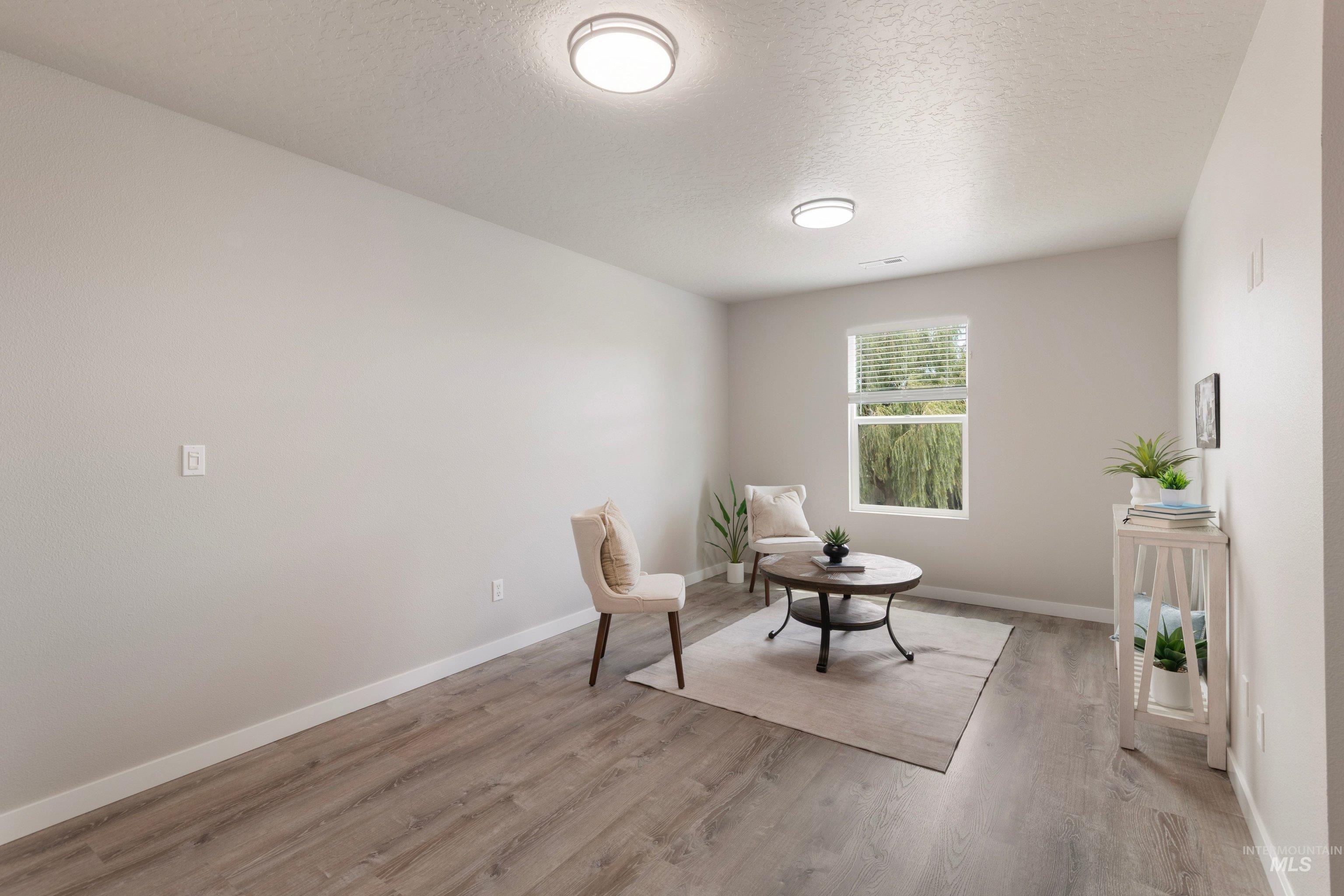 16759 Abram Avenue Caldwell, ID 83607 - Photo 23 of 33 Bright room with wood-finish flooring and neutral wall tones