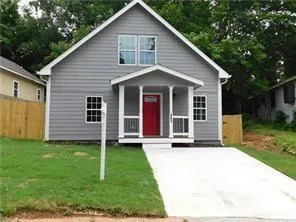 a view of a yard in front view of a house