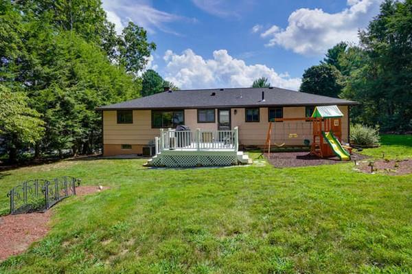 19 McAdams Road Framingham, MA 01701 - Photo 3 of 27 a view of a house with backyard and a tree
