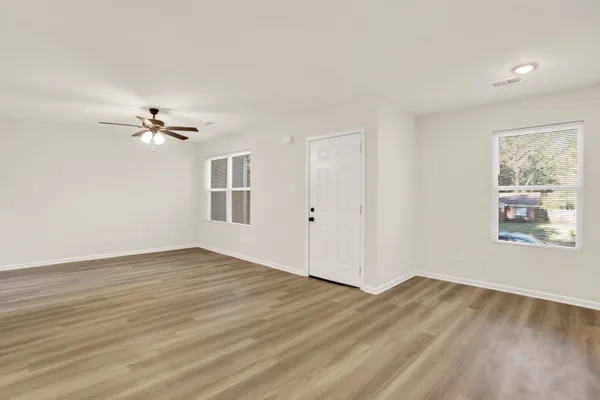 a view of an empty room with a window