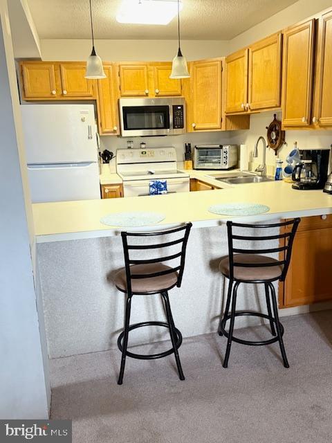 14401 Tunnel Avenue, Unit 262 Ocean City, MD 21842 - Photo 4 of 14 a kitchen with stainless steel appliances kitchen island a large window and cabinets