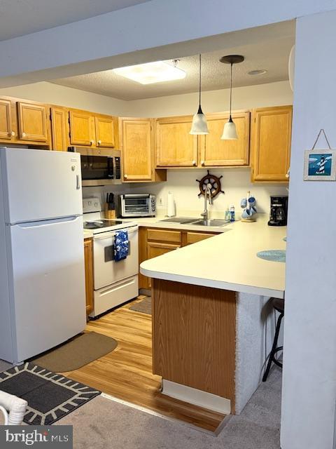 14401 Tunnel Avenue, Unit 262 Ocean City, MD 21842 - Photo 5 of 14 a kitchen with a sink appliances and cabinets