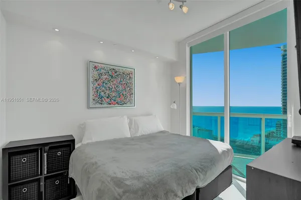 a bedroom with a bed and a desk