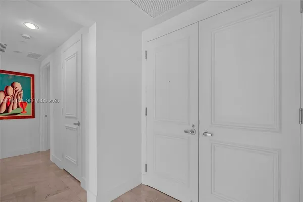 a spacious bathroom with sinks mirror and a bathtub