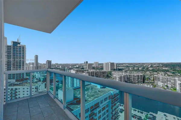 a view of a city skyline from a balcony