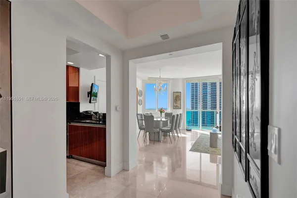 a dining room with furniture and a livingroom view