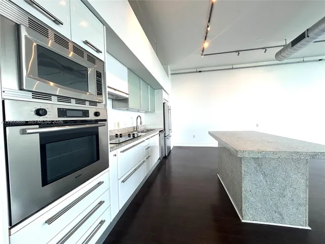 a kitchen with a stove and a microwave