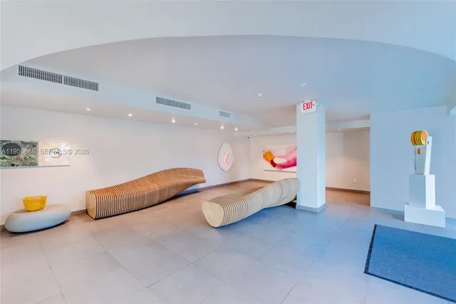 a view of a chairs and table on the wooden floor