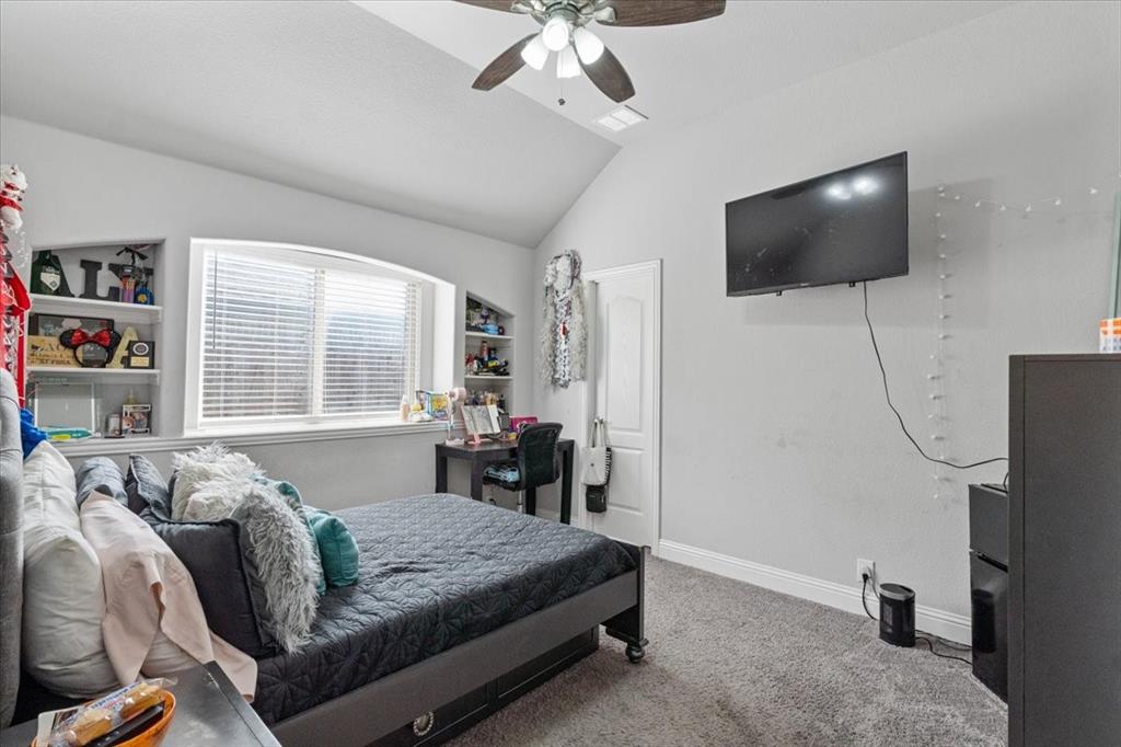 4209 Misty Ridge Street Mesquite, TX 75181 - Photo 11 of 40 a living room with furniture and a flat screen tv
