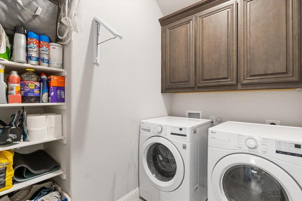 4209 Misty Ridge Street Mesquite, TX 75181 - Photo 15 of 40 a view of storage and utility room with washer and dryer