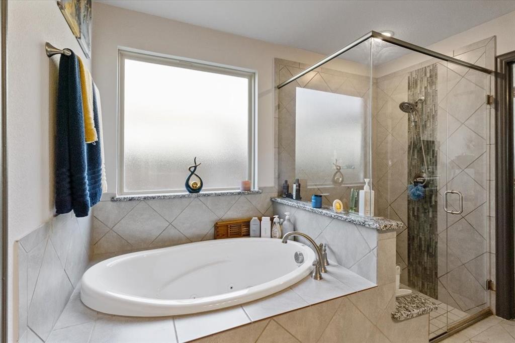 4209 Misty Ridge Street Mesquite, TX 75181 - Photo 29 of 40 a bathroom with a sink and a mirror