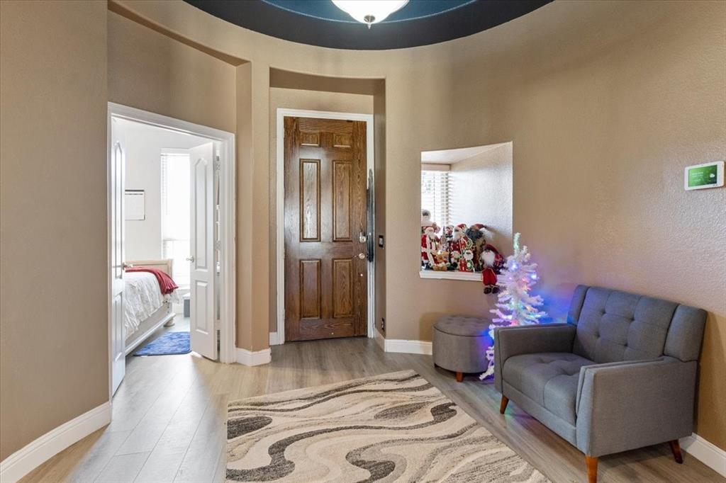 4209 Misty Ridge Street Mesquite, TX 75181 - Photo 9 of 40 a living room with furniture and a potted plant